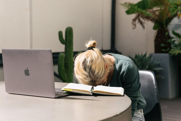 A tired professional at a desk
